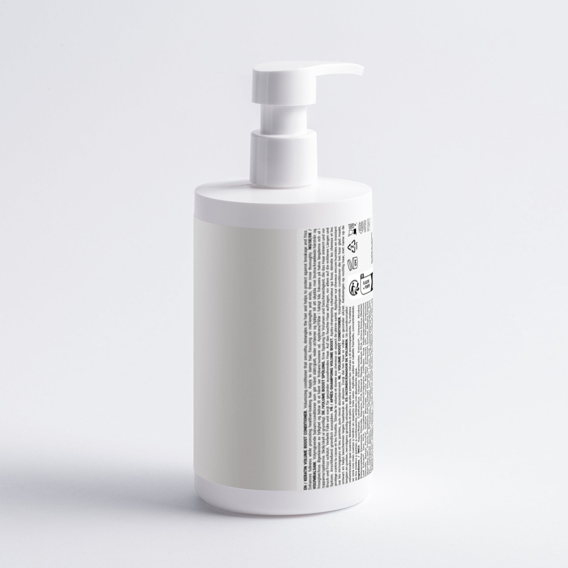 White bottle with a pump on a light gray background