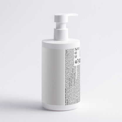 White bottle with a pump on a light gray background
