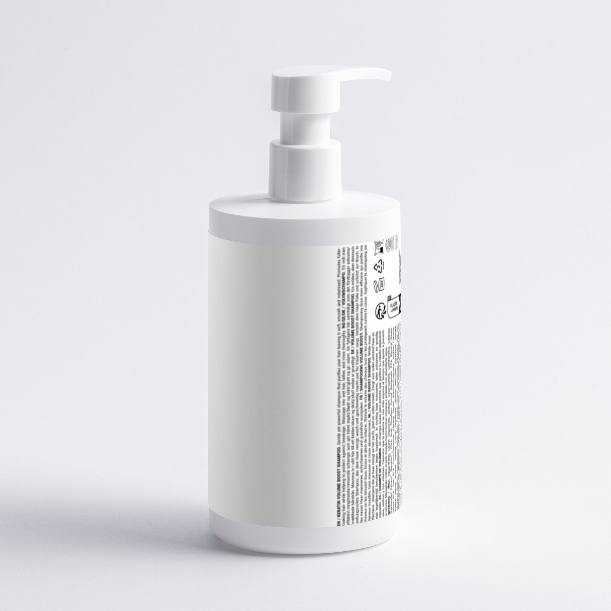White bottle with pump on a light gray background