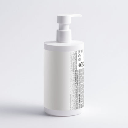 White bottle with pump on a light gray background