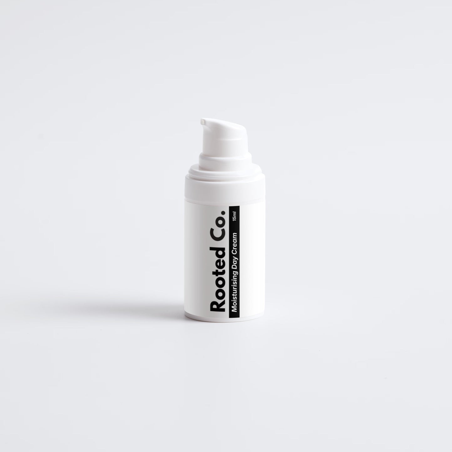 White bottle with 'Rooted Co.' label on a light gray background